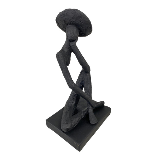 Escultura en forma de mujer